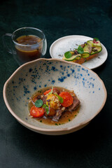 A rustic, but at the same time exquisite dish with juicy meat and bright cherry tomatoes combined with refreshing cucumber toasts. Rich tea completes the culinary experience.