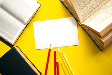 Quarantine concept - flatlay photo with color pencils, books  and the card with the text Stay Home