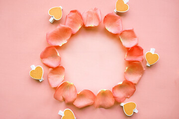 Round mockup frame of rose petals on pink background. Love concept