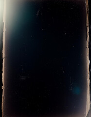 Vintage distressed old photo light leaks, film grain, dust and scratches texture overlay with vignette border. Dirty grunge analog 8k widescreen retro effect background with copy space