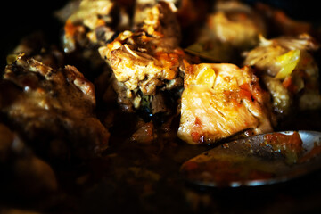 delicious homemade fried meat in a pan, closeup