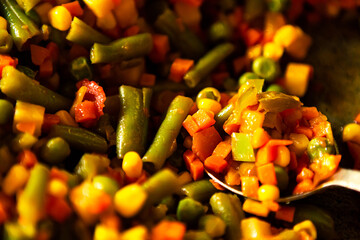 delicious fried vegetables in the pan, closeup