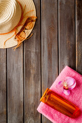 Summer holiday beach background. Female straw hat with sunscreen and sunglasses, top view - 793861631
