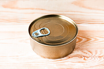 canned fish pack as a quarantine stock on wooden background