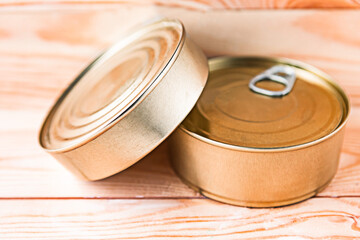 canned fish packs as a quarantine stock on wooden background
