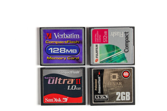 Four low capacity old compactflash or CF cards of various brands. Media, storage cards for digital cameras.
