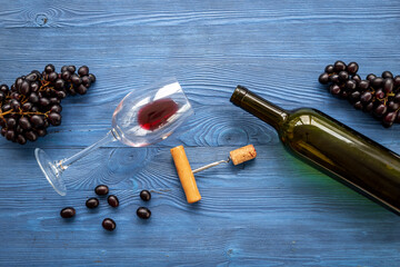 Open bottle of red wine with bunch of grapes and cork, top view - 793865416