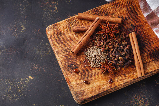 aromatic Chinese five spices on a dark rustic background