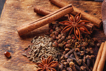 aromatic Chinese five spices on a dark rustic background