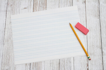 Ruled lined paper with pencil for school