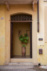 Fototapeta na wymiar Old wooden door in the old town of Verona, Italy