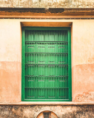 Vintage green wooden window at an old mosque in Kolkata, West Bengal, India in January 2023....