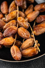 date branch dried sweet fruit fresh meal food snack on the table copy space food background rustic top view