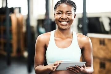 Fitness, portrait and tablet with sports black woman in gym for coaching, training or workout. App,...