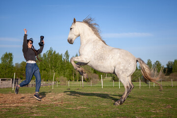 beautiful woman making pictures of horse