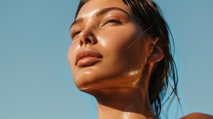 A woman with long hair and a tan complexion is standing in the sun