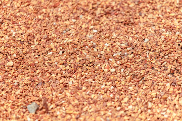 Small orange crushed stone. As a background