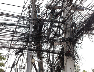 Electric wires on poles in the city - 793901091
