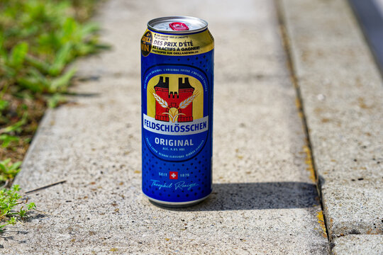Blue Swiss beer can brand name Feldschl&ouml;sschen outdoors at own terrace at City of Z&uuml;rich on a sunny summer day. Photo taken August 14th, 2023, Zurich, Switzerland.
