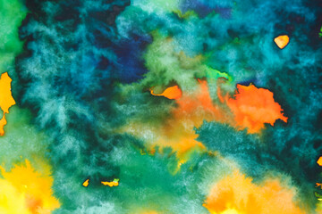 Abstract watercolor background with multicolored spots and stains on paper