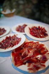 close up view of a plate of serrano ham, classic spanish