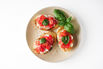 delicious Italian bruschetta with tomatoes on a white background