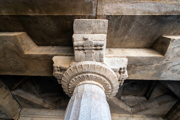 A detailed view of a carved pillar with Jain motifs in Shravanabelagola.