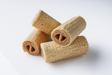 crispy dessert wafer rolls on a white background