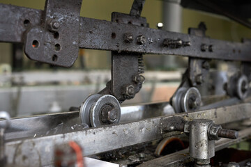 Parts of a production equipment conveyor in a production workshop