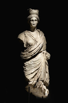 Tyche goddess statue from Perge in chiaroscuro lighting, black background. Art and culture. Antalya Archeological Museum, Turkey (Turkiye). July 28, 2023