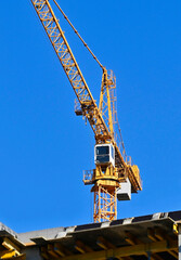 Fototapeta na wymiar Tower crane and construction