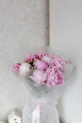 pink peonies on a white table background
