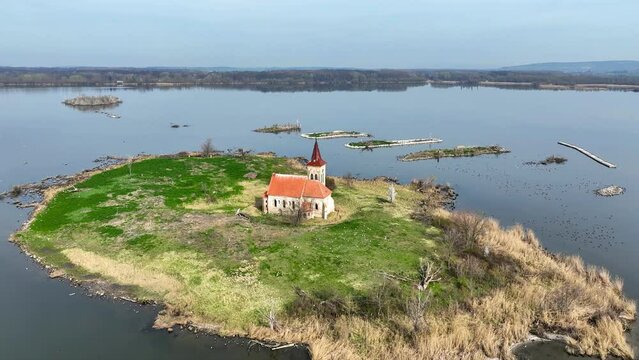 Musov Island in South Moravia, Czech Republic, with medieval Gothic saint Linhart (Leonard) church, now abandoned, after the village was flooded by the Nowe Mlyny (New Mills) dam lake. Aerial video
