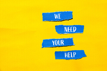 We need your help words written on ripped blue paper pieces with yellow background. Conceptual we...