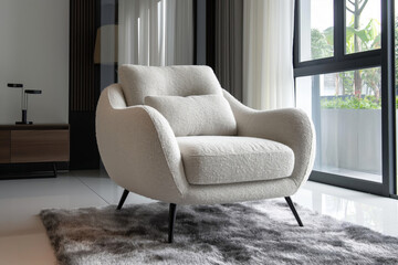 Beige contemporary accent chair with minimalist upholstery in a chic room setting