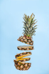Levitation photo of flying sliced pineapple