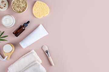 Natural eco friendly beauty skin care products with white tube mockup flat lay on pink background. Woman body self-care routine, facial mask or creamy scrub with oats flake, home spa cosmetics banner