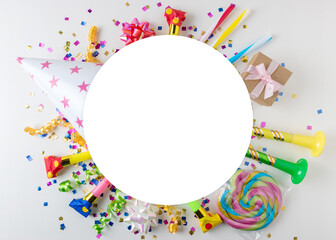 Colorful celebration background with various party confetti, streamers and decoration. Minimal...