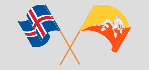 Crossed and waving flags of Iceland and Bhutan
