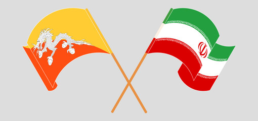 Crossed and waving flags of Bhutan and Iran