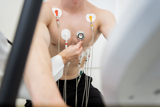Determined athlete undergoing rigorous cardiac stress test in clinical setting
