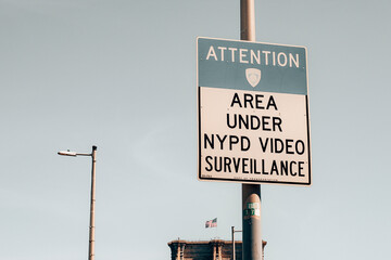 Aera under NYPD video surveillance road sign on the side of the street in Manhattan - New York City.