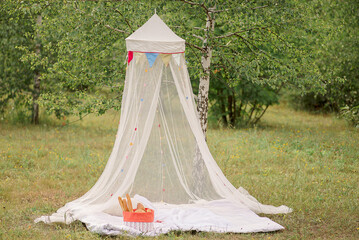 canopied picnic in the forest in summer