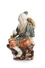 Chinese elder porcelain figurine isolated on white background.