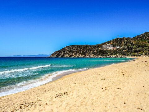 Beautiful Spiaggia di Solanas  Beach with turquoise waters, sandy shores, and blue  sky.