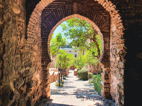 Gate of the Wall and the Gardens of the Alcazaba in the City of Malaga, Andalusia, Spain