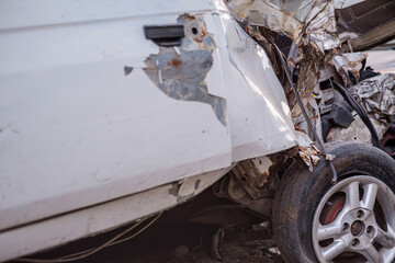 Car accident. A wrecked passenger car. Fatal road accident photo. Selective focus.