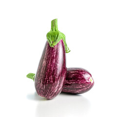 Two ripe graffiti eggplants isolated on a white background. Food concept.