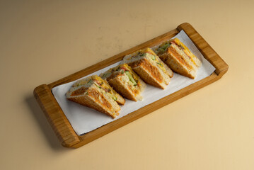 Vegetable club sandwich with Cheese on a wooden container