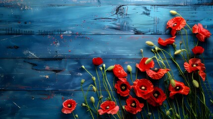 Red poppies on the rustic blue wooden background. Symbolizing Remembrance Day, patriotic, hope, honor theme